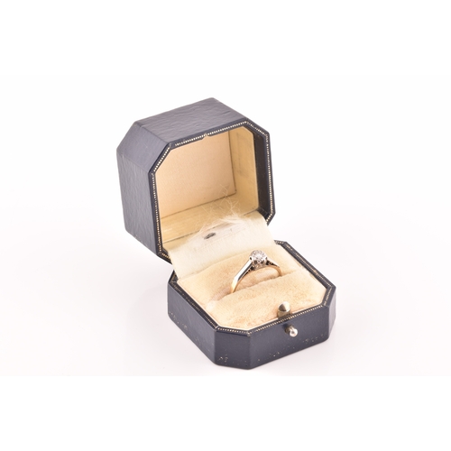 33 - A mid 20th century 18ct yellow gold and platinum solitaire ring, set to centre with a round brillian... 