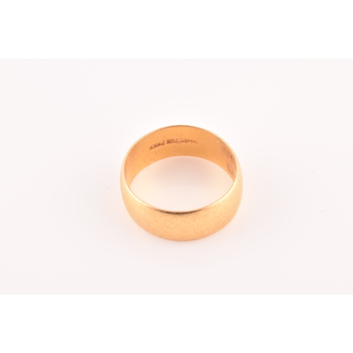 35 - A 22ct gold wedding band, with full hallmarks for Birmingham 1996 by B M S, 7.5 mm width, size Q.