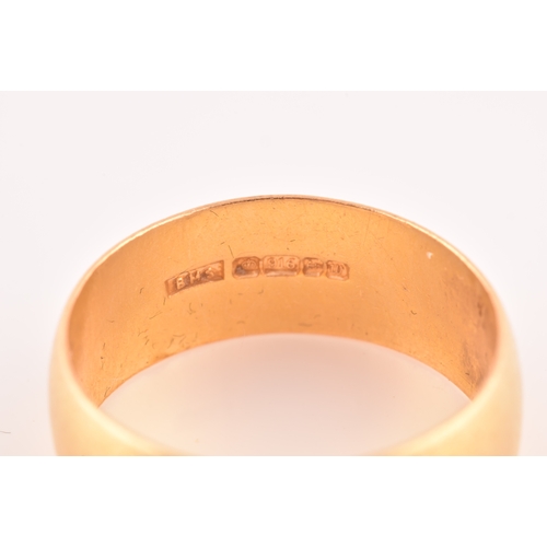 35 - A 22ct gold wedding band, with full hallmarks for Birmingham 1996 by B M S, 7.5 mm width, size Q.