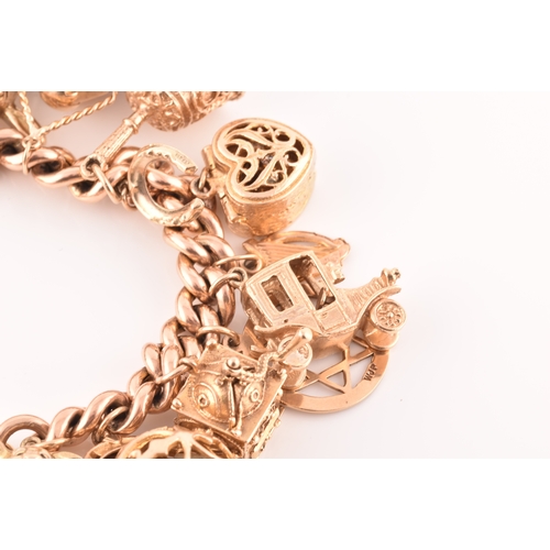 1 - A 9ct rose gold curb link charm bracelet, suspended with a vast collection of 9ct yellow gold charms... 