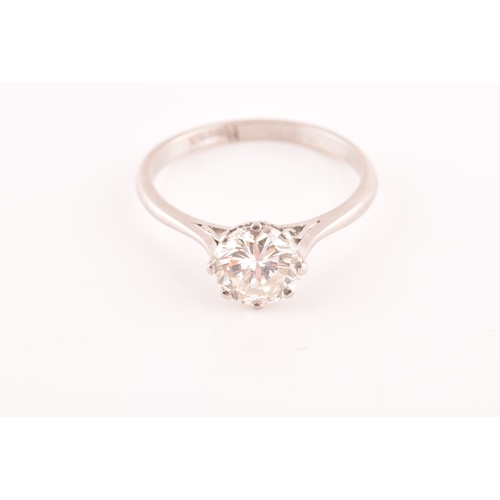 3 - A platinum diamond solitaire ring, set to centre with a round brilliant cut diamond with an approxim... 