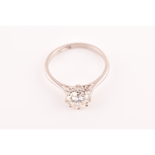 3 - A platinum diamond solitaire ring, set to centre with a round brilliant cut diamond with an approxim... 