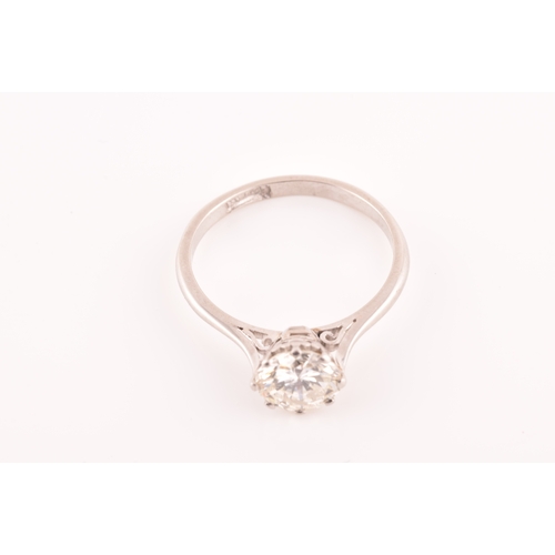 3 - A platinum diamond solitaire ring, set to centre with a round brilliant cut diamond with an approxim... 