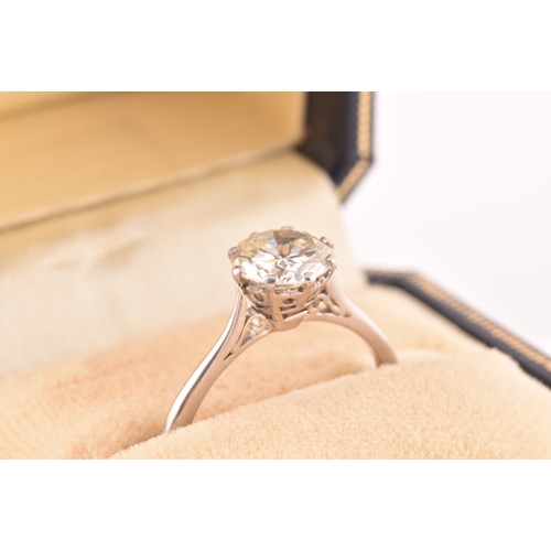 3 - A platinum diamond solitaire ring, set to centre with a round brilliant cut diamond with an approxim... 