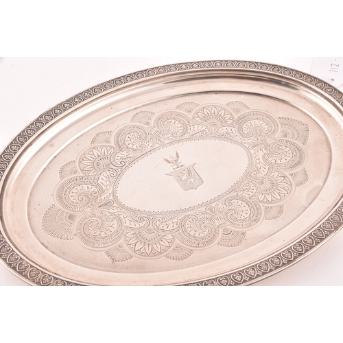 126 - A George IV silver oval shaped tray, Hallmarked Birmingham 1820, with engraved crest and decoration,... 