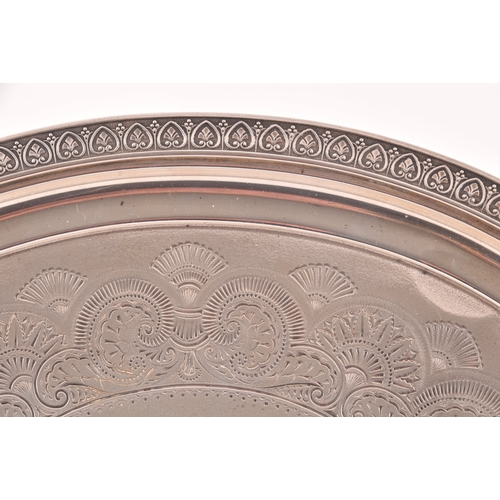 126 - A George IV silver oval shaped tray, Hallmarked Birmingham 1820, with engraved crest and decoration,... 