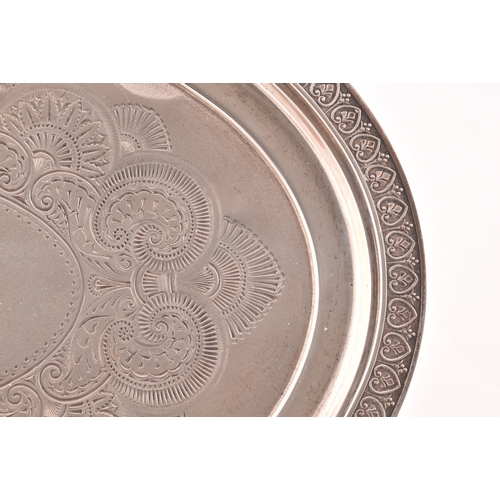 126 - A George IV silver oval shaped tray, Hallmarked Birmingham 1820, with engraved crest and decoration,... 