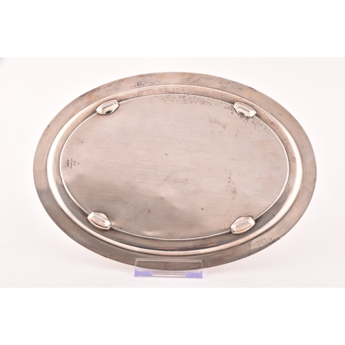 126 - A George IV silver oval shaped tray, Hallmarked Birmingham 1820, with engraved crest and decoration,... 