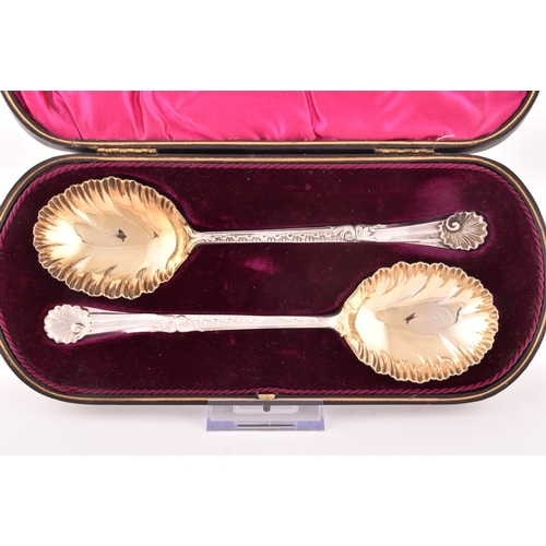 130 - A pair of Edward VII silver and gilt fruit serving spoons, hallmarked Sheffield 1910 by Walker &... 