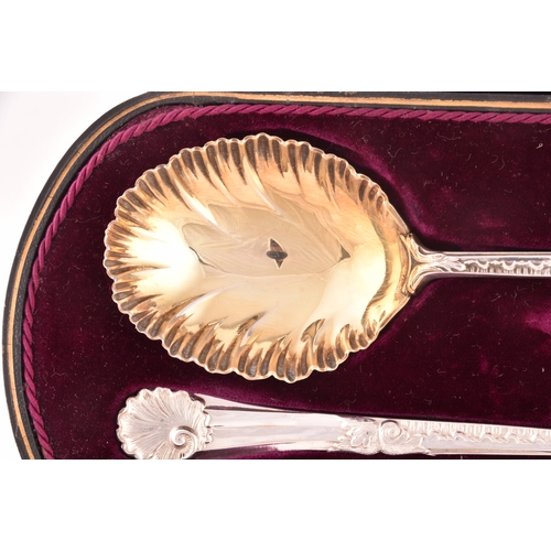 130 - A pair of Edward VII silver and gilt fruit serving spoons, hallmarked Sheffield 1910 by Walker &... 