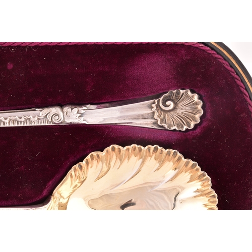 130 - A pair of Edward VII silver and gilt fruit serving spoons, hallmarked Sheffield 1910 by Walker &... 