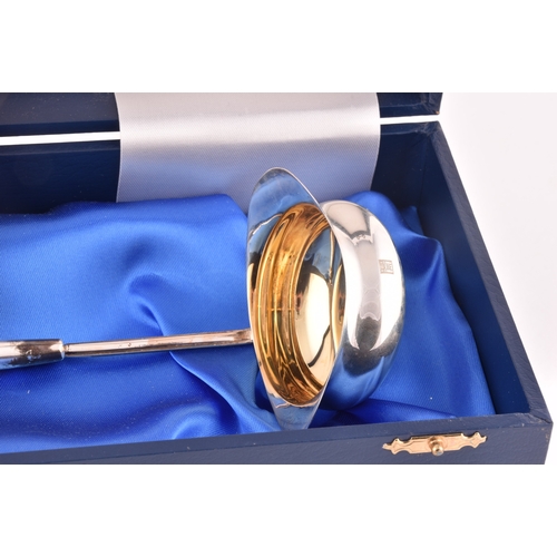 134 - A Silver Jubilee toddy ladle with 1897 shilling inset in the bowl, limited edition of 500, by The Ro... 