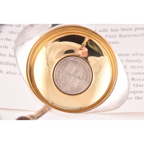 134 - A Silver Jubilee toddy ladle with 1897 shilling inset in the bowl, limited edition of 500, by The Ro... 