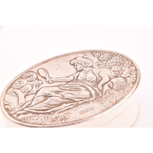 140 - An Elizabeth II silver topped leather trinket box with embossed design of a classical reclining lady... 