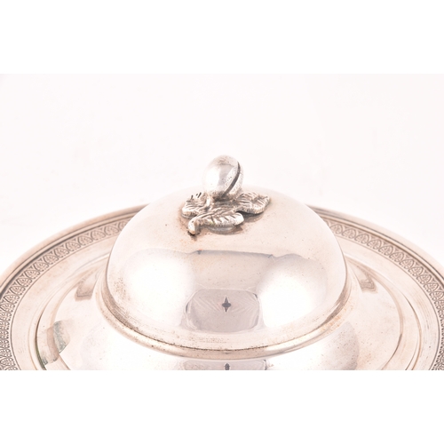 141 - A silver three piece caviar serving lidded dish, with inside tray, set with a decorative floral top ... 