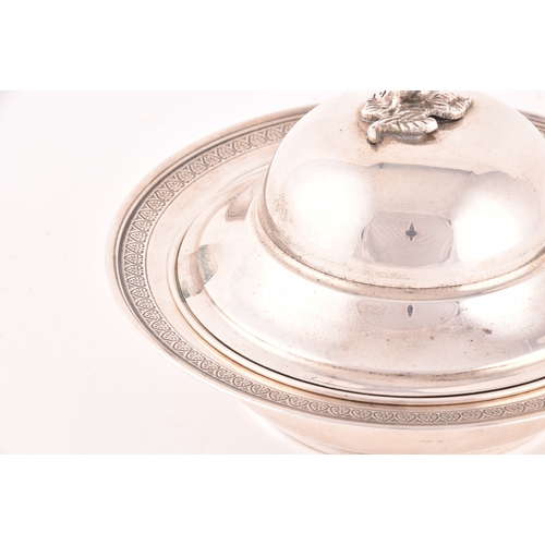 141 - A silver three piece caviar serving lidded dish, with inside tray, set with a decorative floral top ... 