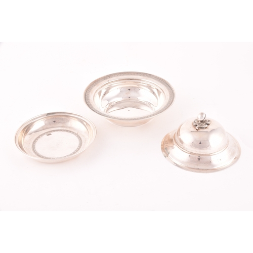 141 - A silver three piece caviar serving lidded dish, with inside tray, set with a decorative floral top ... 