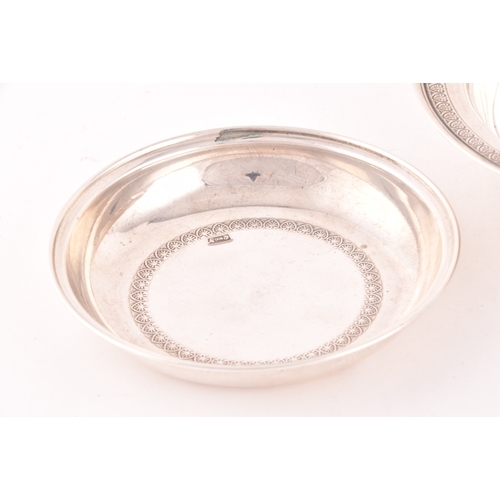 141 - A silver three piece caviar serving lidded dish, with inside tray, set with a decorative floral top ... 