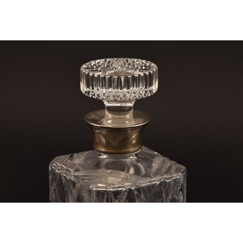 142 - A silver mounted cut crystal glass whisky decanter and stopper, with silver mounted collar, hallmark... 