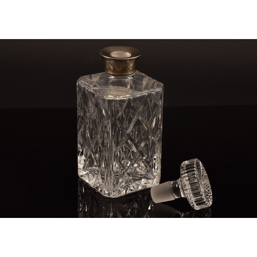 142 - A silver mounted cut crystal glass whisky decanter and stopper, with silver mounted collar, hallmark... 