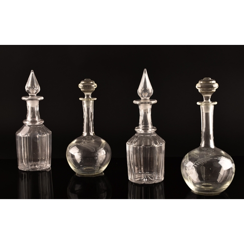 232 - A matched pair of Victorian cut glass decanters and stoppers, together with a pair of engraved decan... 