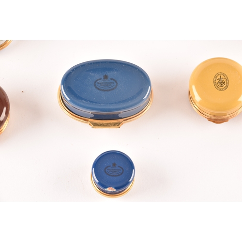 87 - A collection of enamel pill boxes of varying shapes and sizes, including maker's such as Halcyon Day... 