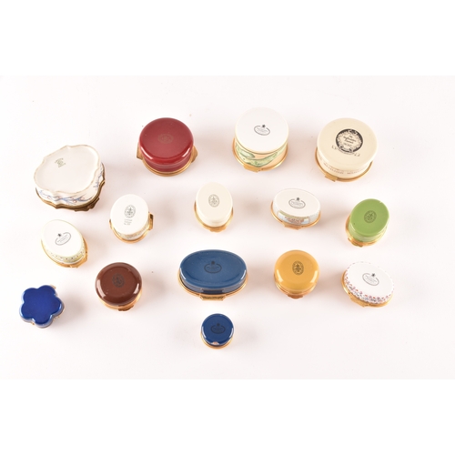 87 - A collection of enamel pill boxes of varying shapes and sizes, including maker's such as Halcyon Day... 