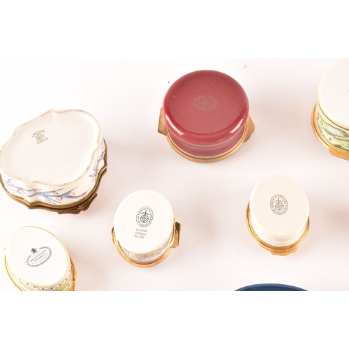 87 - A collection of enamel pill boxes of varying shapes and sizes, including maker's such as Halcyon Day... 