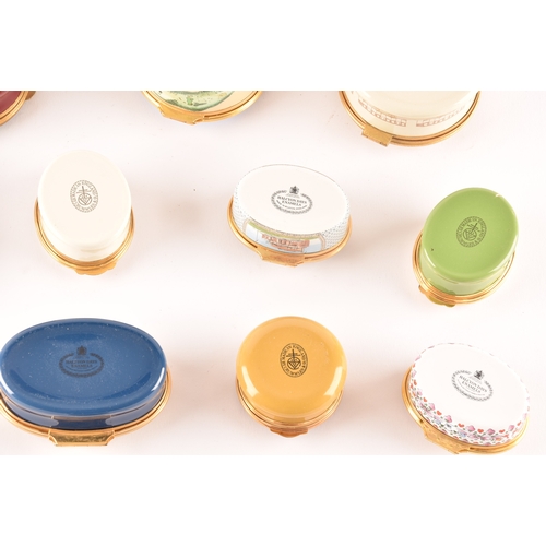 87 - A collection of enamel pill boxes of varying shapes and sizes, including maker's such as Halcyon Day... 