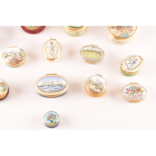 87 - A collection of enamel pill boxes of varying shapes and sizes, including maker's such as Halcyon Day... 