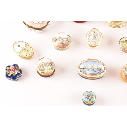 87 - A collection of enamel pill boxes of varying shapes and sizes, including maker's such as Halcyon Day... 