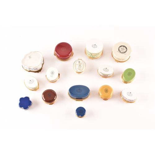 87 - A collection of enamel pill boxes of varying shapes and sizes, including maker's such as Halcyon Day... 