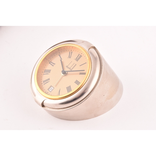 279 - A Dunhill quartz desk clock, the gilt dial with Roman numerals, date aperture, numbered D 10314, in ... 