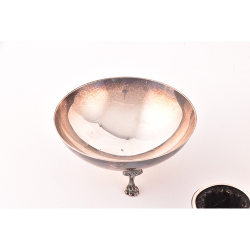 148 - A collection of silver items, including a footed dish, a decorative bowl with embossed fruit decorat... 