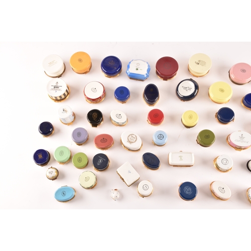 88 - A large collection of enamel pill boxes of varying shapes and sizes, maker's including Royal Worcest... 