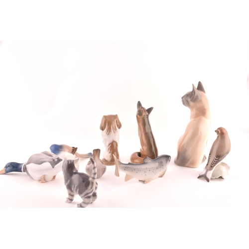 241 - A collection of nine Royal Copenhagen figurines, including a cat, kitten, dog, fish, duck, fox and b... 