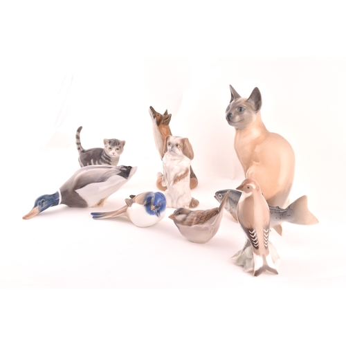 241 - A collection of nine Royal Copenhagen figurines, including a cat, kitten, dog, fish, duck, fox and b... 