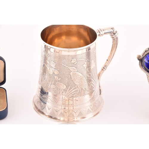 152 - A collection of antique silver, including a Victorian aesthetic movement tankard, engraved with bird... 