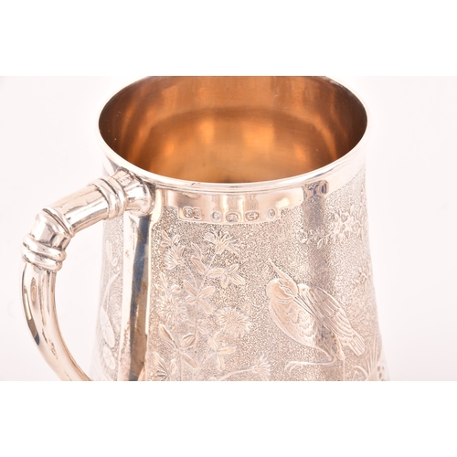 152 - A collection of antique silver, including a Victorian aesthetic movement tankard, engraved with bird... 