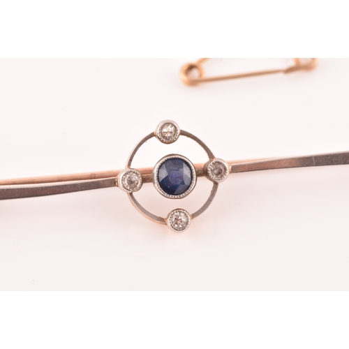 43 - A 15ct rose gold bar brooch, set with a round old cut sapphire and four round eight cut diamonds, wi... 