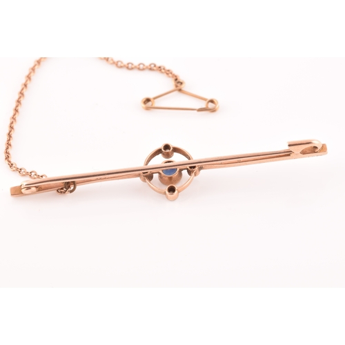 43 - A 15ct rose gold bar brooch, set with a round old cut sapphire and four round eight cut diamonds, wi... 