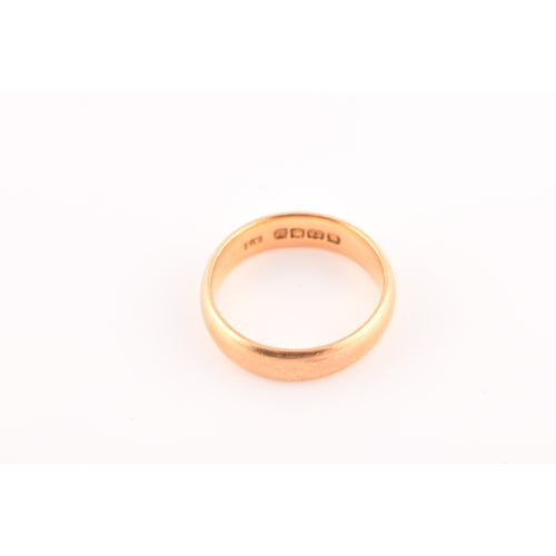 44 - A 22ct yellow gold wedding band, hallmarked London 1931 by E.K, size L 1/2, 5mm, 6.1 grams.