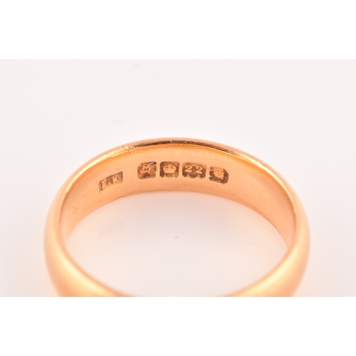 44 - A 22ct yellow gold wedding band, hallmarked London 1931 by E.K, size L 1/2, 5mm, 6.1 grams.