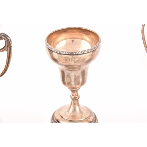 154 - A collection of assorted silver items including four miniature trophy cups on stands, three 19th cen... 