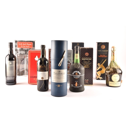 320 - An assortment of alcohol, including two boxed bottles of Chivas Regal whisky, one cased bottle of Ta... 