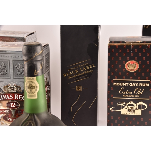 320 - An assortment of alcohol, including two boxed bottles of Chivas Regal whisky, one cased bottle of Ta... 