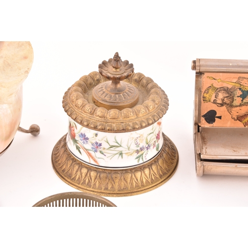 260 - A collection of decorative objects including a mother-of-pearl conch shell, a pair of silver pin tra... 