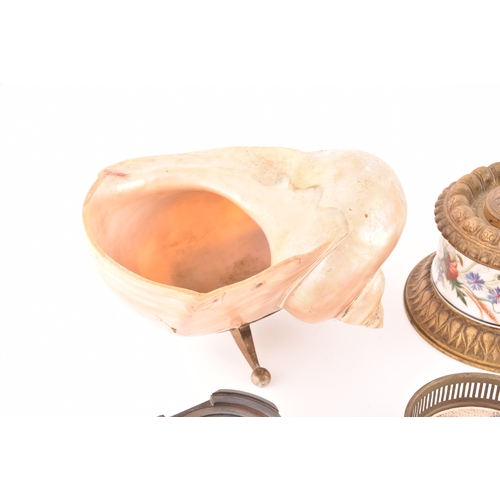 260 - A collection of decorative objects including a mother-of-pearl conch shell, a pair of silver pin tra... 