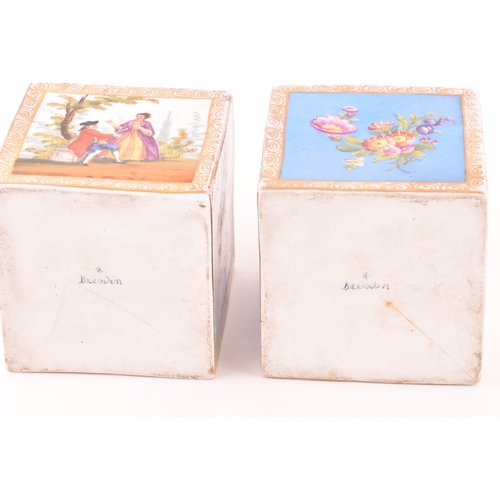 246 - A pair of Dresden porcelain square canisters and covers, painted with panels of figures in landscape... 