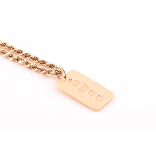 50 - A 9ct yellow gold ingot, hallmarked for London 1977 by K M J, on a 14ct yellow gold twisted rope cha... 